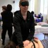 practicing massage with blind fold